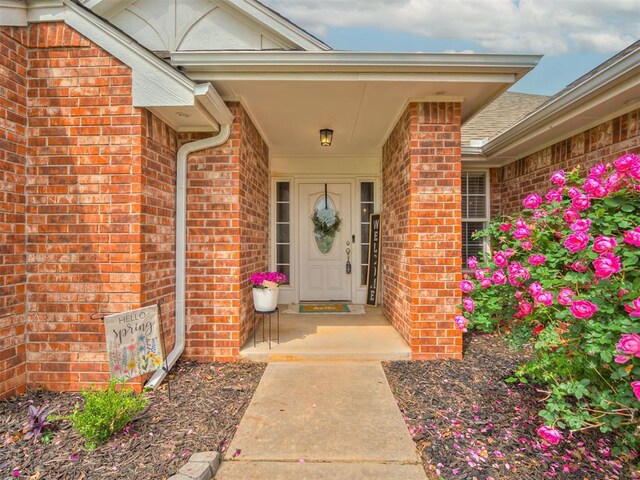 property entrance with brick siding
