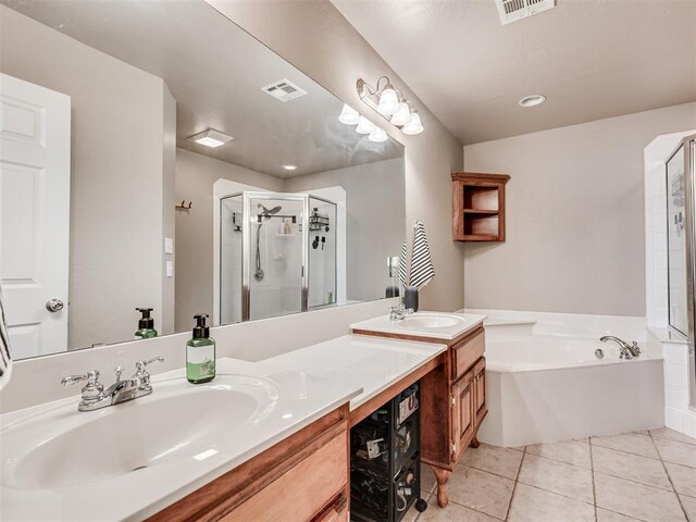 bathroom featuring a sink, a shower stall, and visible vents