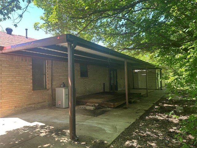 view of side of property featuring brick siding