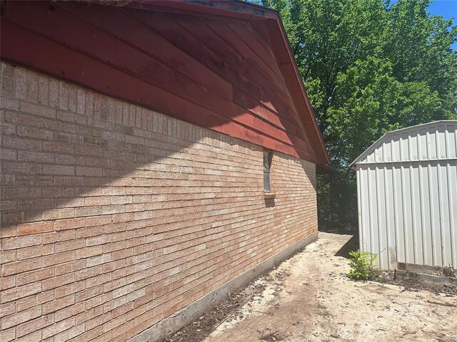 view of home's exterior featuring brick siding