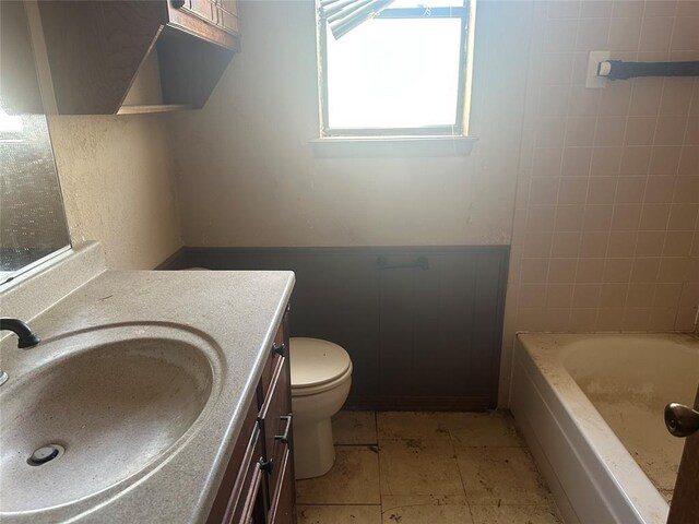 bathroom featuring toilet and vanity