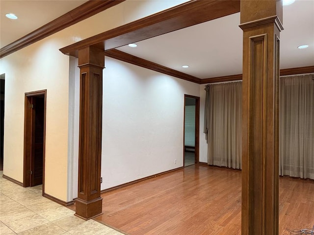 3900 Chickasha, Edmond, OK 73013 - unfurnished living room with crown molding, recessed lighting, baseboards, and decorative columns