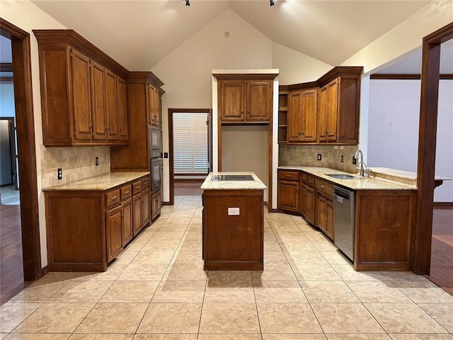 3900 Chickasha, Edmond, OK 73013 - kitchen featuring a sink, a kitchen island, backsplash, and black appliances