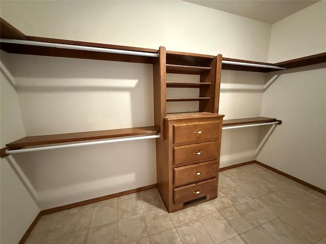 3900 Chickasha, Edmond, OK 73013 - spacious closet featuring light tile patterned flooring