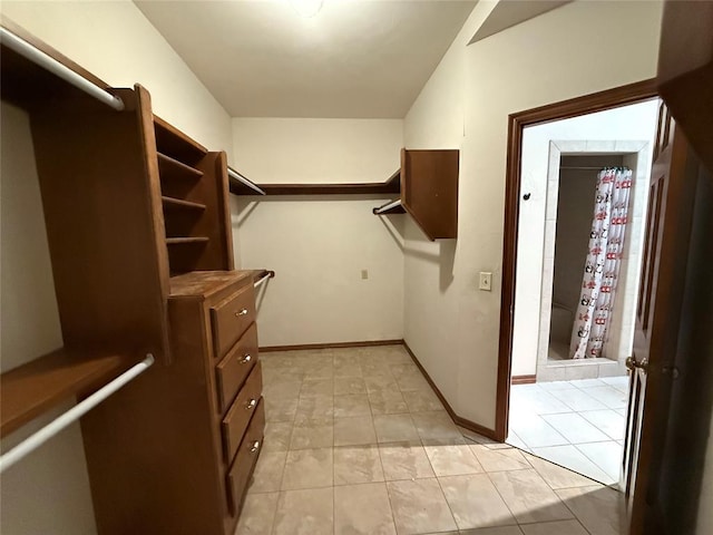 3900 Chickasha, Edmond, OK 73013 - walk in closet featuring light tile patterned flooring