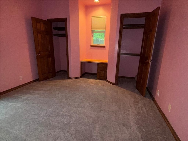 3900 Chickasha, Edmond, OK 73013 - unfurnished bedroom with built in study area, carpet floors, and baseboards