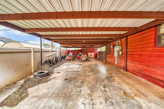 view of parking with an attached carport