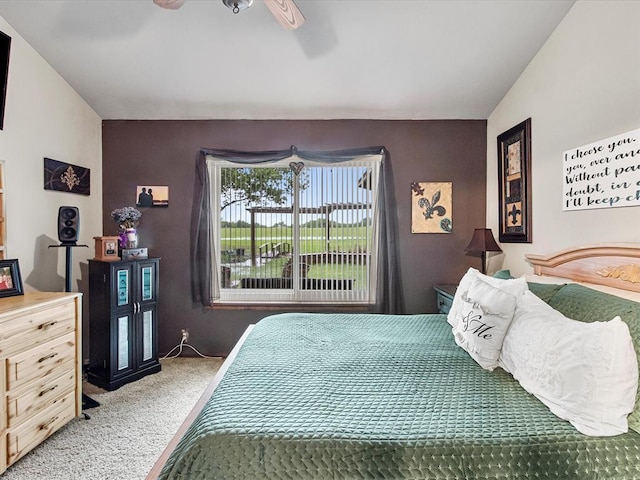 carpeted bedroom featuring a ceiling fan