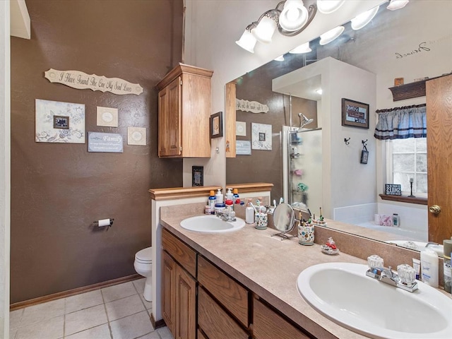 full bath with a sink, tile patterned floors, a shower stall, and toilet
