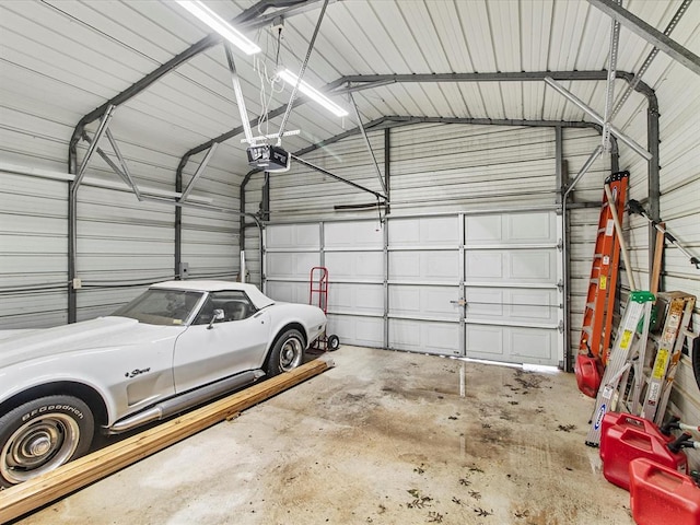 garage with metal wall and a garage door opener