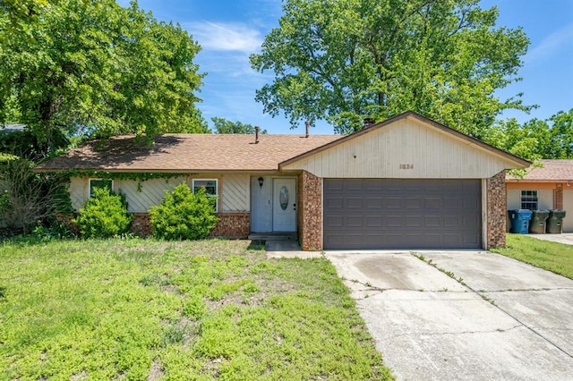 1824 David Ter, Oklahoma City, OK 73141 - ranch-style house with an attached garage, concrete driveway, brick siding, and a front lawn