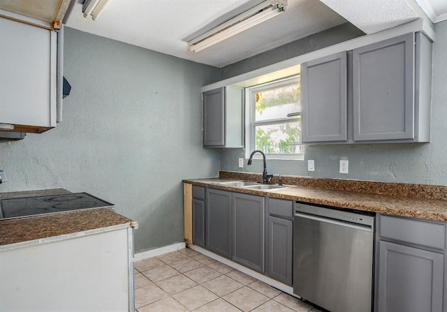 1824 David Ter, Oklahoma City, OK 73141 - kitchen with light tile patterned floors, a sink, dark countertops, dishwasher, and gray cabinetry