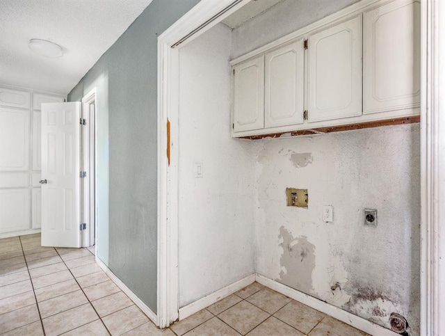 1824 David Ter, Oklahoma City, OK 73141 - clothes washing area featuring baseboards, hookup for a washing machine, light tile patterned flooring, hookup for an electric dryer, and cabinet space