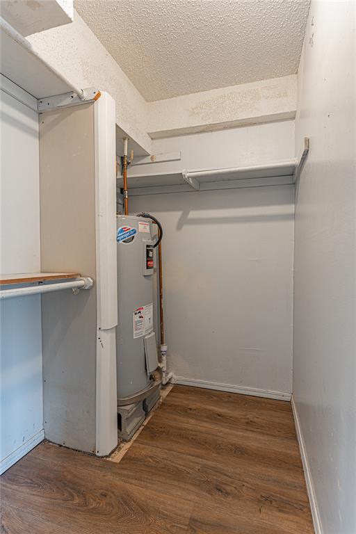 utility room featuring electric water heater