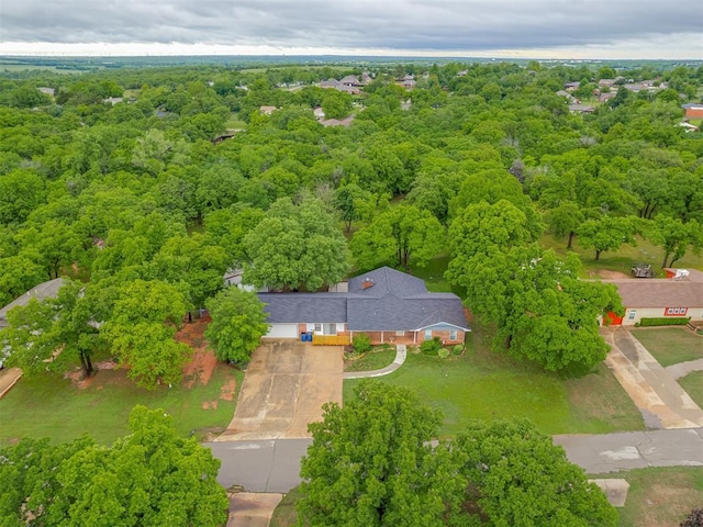 aerial view featuring a wooded view