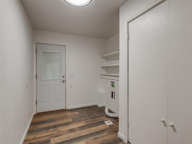 washroom featuring baseboards, laundry area, and dark wood-type flooring