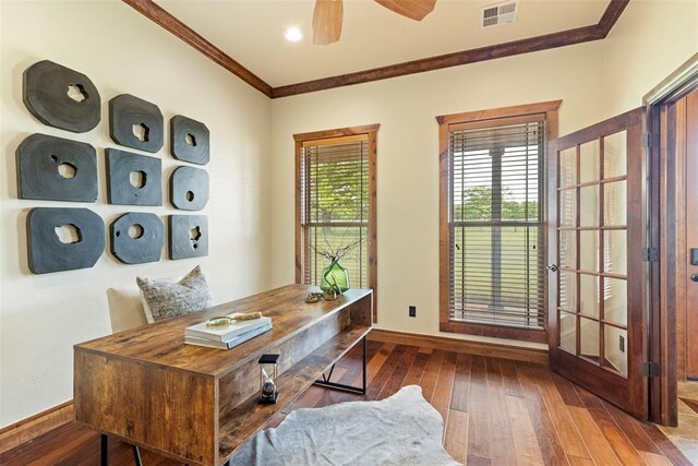 home office featuring crown molding, ceiling fan, hardwood / wood-style floors, baseboards, and visible vents