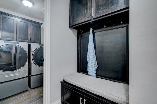 13313 Watson Dr, Piedmont, OK 73078 - laundry area with light wood-style floors, cabinet space, baseboards, and washer and dryer