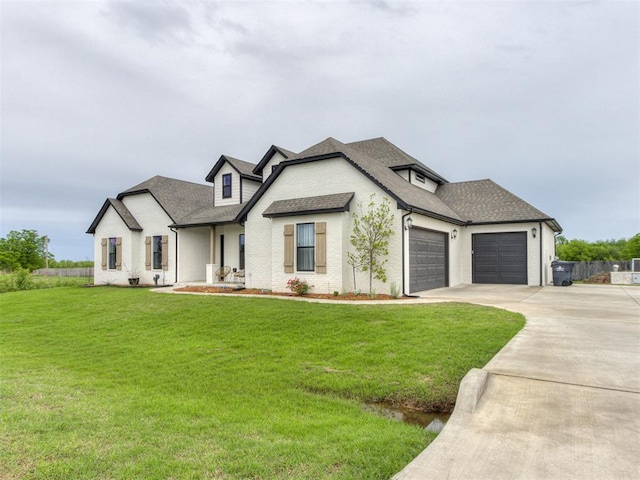 18444 Posse Trl, Norman, OK 73071 - modern inspired farmhouse with roof with shingles, an attached garage, concrete driveway, and a front lawn