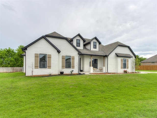 18444 Posse Trl, Norman, OK 73071 - modern farmhouse featuring fence, a shingled roof, a front yard, and brick siding