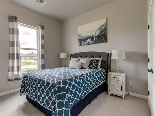 18444 Posse Trl, Norman, OK 73071 - bedroom with light colored carpet, baseboards, and visible vents