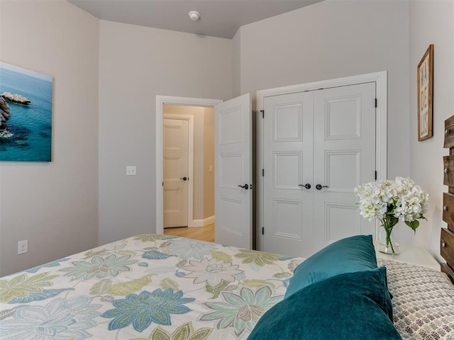 18444 Posse Trl, Norman, OK 73071 - bedroom with a closet and light wood finished floors