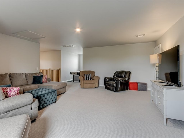 18444 Posse Trl, Norman, OK 73071 - living room featuring visible vents, attic access, baseboards, and light carpet