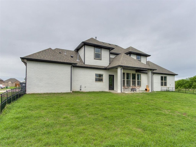 18444 Posse Trl, Norman, OK 73071 - back of property with a yard, a fenced backyard, roof with shingles, and a patio area