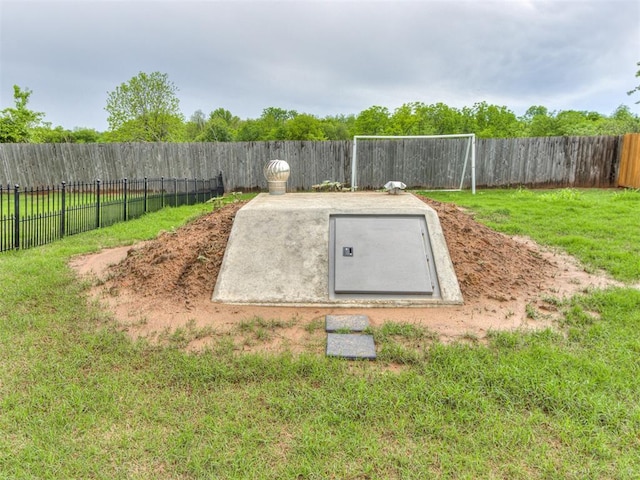 18444 Posse Trl, Norman, OK 73071 - view of storm shelter featuring a lawn and a fenced backyard