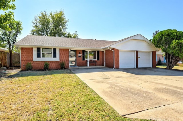 1508 Carlton Way, Oklahoma City, OK 73120 - ranch-style house featuring fence, an attached garage, a front lawn, brick siding, and concrete driveway