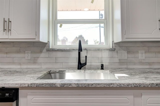 1508 Carlton Way, Oklahoma City, OK 73120 - kitchen with a sink, light countertops, white cabinets, and backsplash