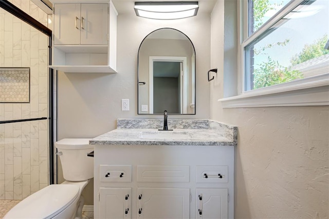 1508 Carlton Way, Oklahoma City, OK 73120 - bathroom with vanity, a stall shower, and toilet