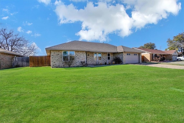 ranch-style home featuring fence, an attached garage, brick siding, a front yard, and concrete driveway