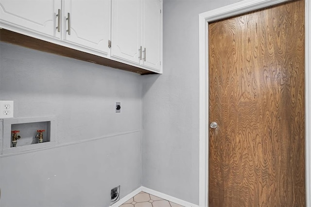 clothes washing area featuring baseboards, hookup for a washing machine, electric dryer hookup, and cabinet space