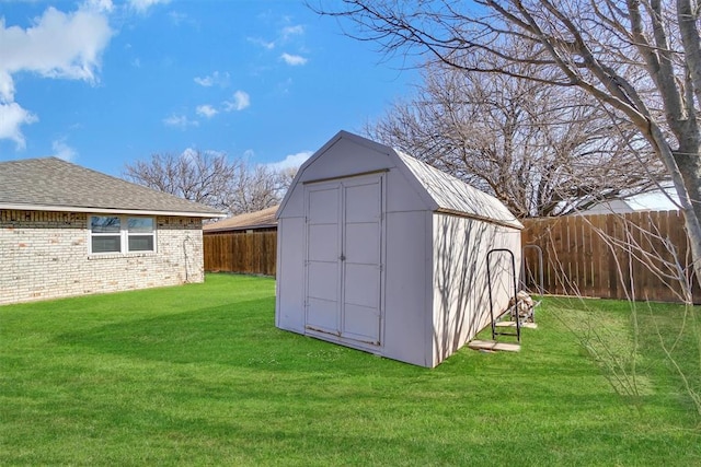 view of shed with a fenced backyard