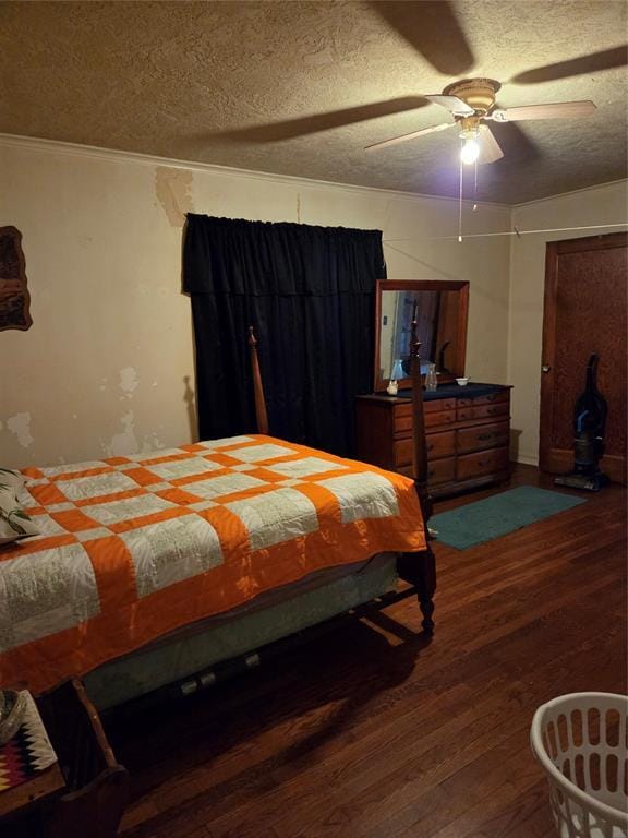 bedroom featuring a ceiling fan, a textured ceiling, and wood finished floors
