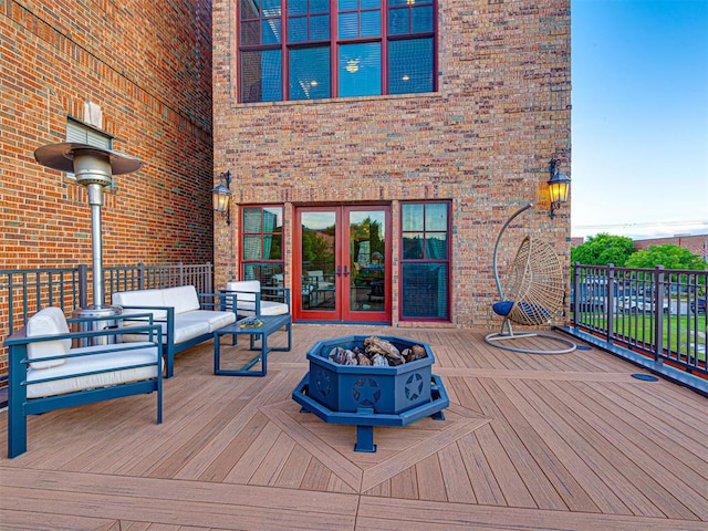 319 NE 1st St, Oklahoma City, OK 73104 - wooden terrace featuring french doors and an outdoor living space with a fire pit