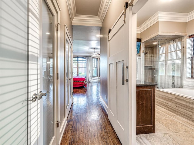 319 NE 1st St, Oklahoma City, OK 73104 - hall with french doors, a barn door, and ornamental molding