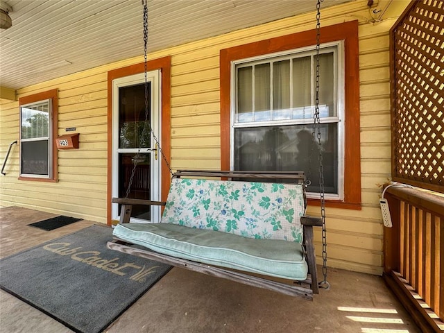 903 Sunset Dr, El Reno, OK 73036 - property entrance with a porch and uncovered parking