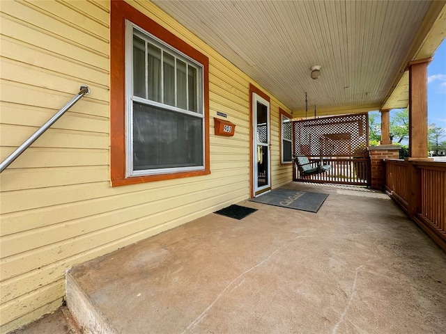 903 Sunset Dr, El Reno, OK 73036 - view of patio / terrace with a porch
