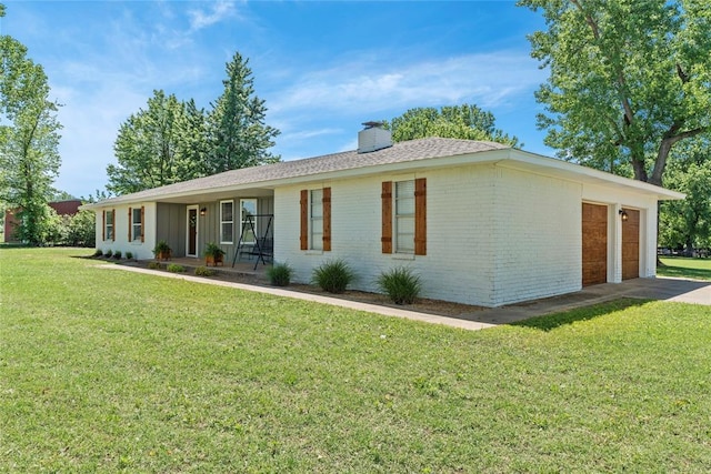 5606 E Tyler Dr, Tuttle, OK 73089 - single story home with brick siding, a chimney, a front yard, concrete driveway, and an attached garage