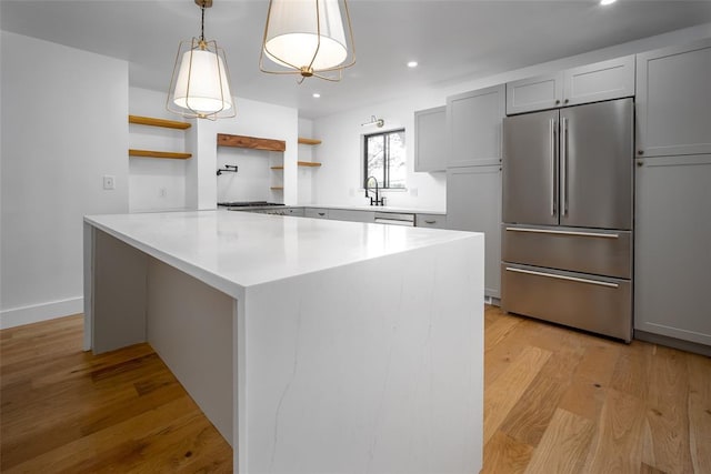kitchen with open shelves, light countertops, stainless steel appliances, recessed lighting, and light wood-type flooring