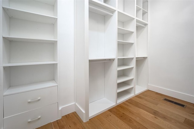 spacious closet with visible vents and light wood-type flooring
