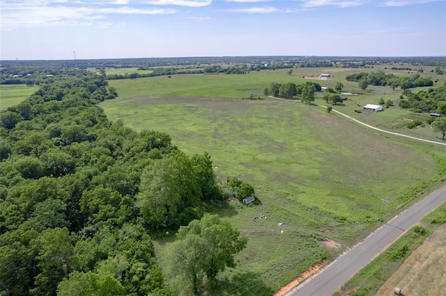 birds eye view of property with a rural view