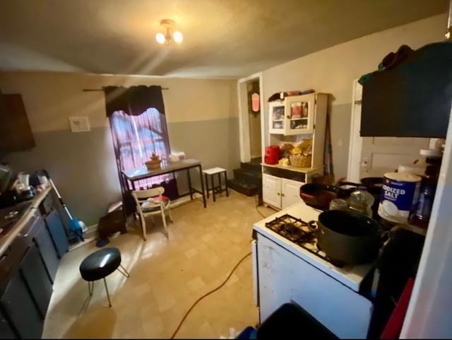 kitchen featuring white cabinets