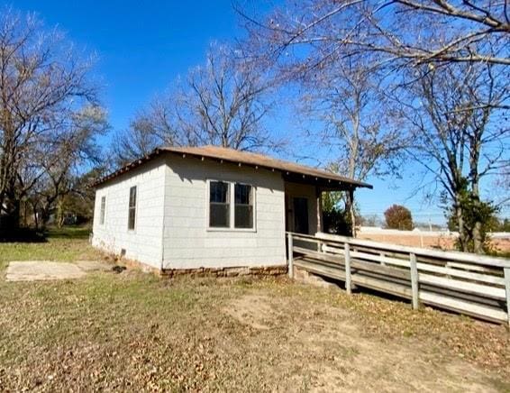 view of home's exterior with fence