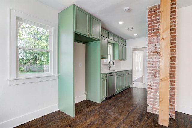 2841 NW 20th St, Oklahoma City, OK 73107 - kitchen featuring visible vents, stainless steel dishwasher, a sink, baseboards, and green cabinetry