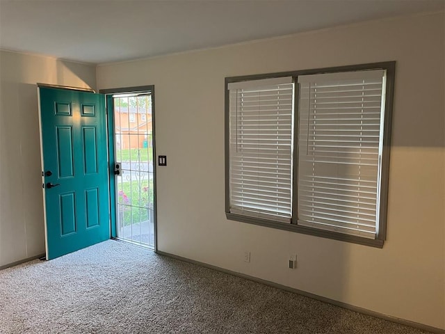 3233 SW 40th St, Oklahoma City, OK 73119 - foyer with baseboards and carpet flooring