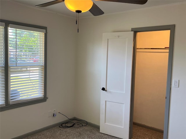 3233 SW 40th St, Oklahoma City, OK 73119 - unfurnished bedroom featuring baseboards, ornamental molding, ceiling fan, and carpet flooring