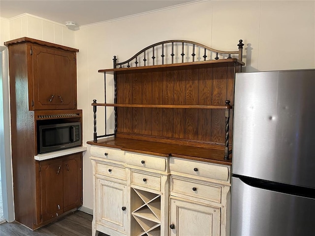 3233 SW 40th St, Oklahoma City, OK 73119 - interior space with open shelves, freestanding refrigerator, black microwave, and dark wood-style floors